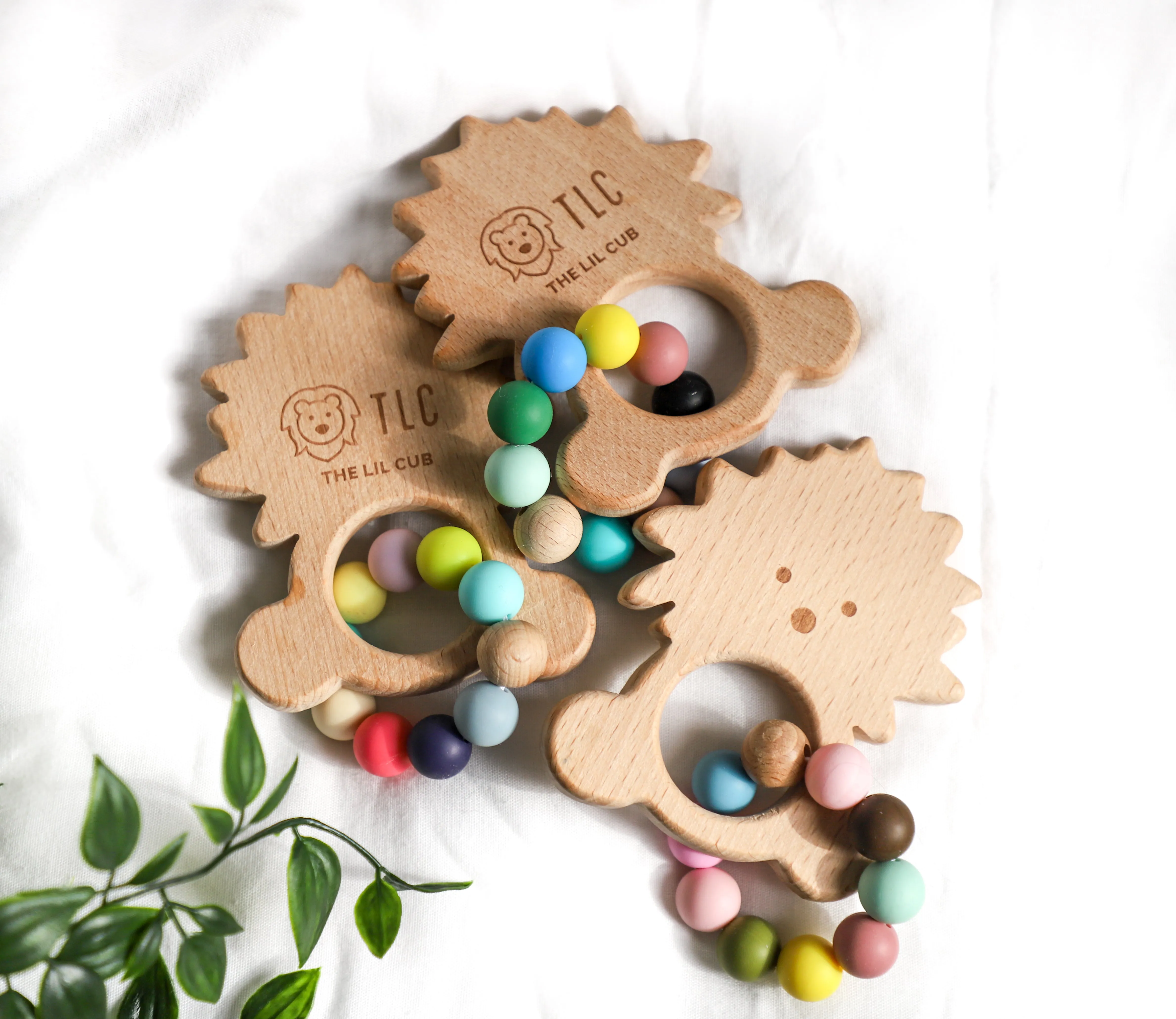 The Lil Cub Wooden teether with silicone beads